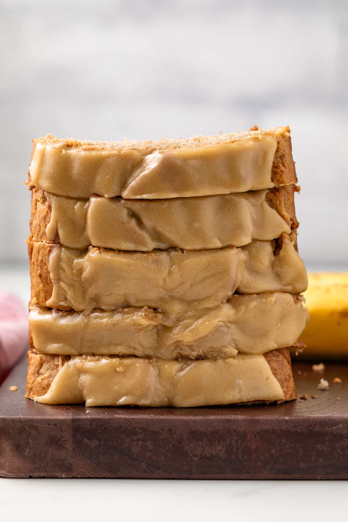 Five slices of salted caramel banana bread stacked.