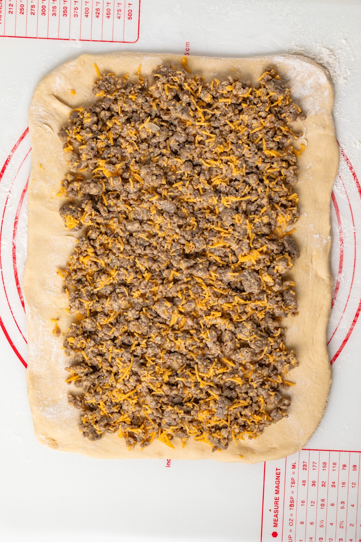 Sausage filling over yeast dough.