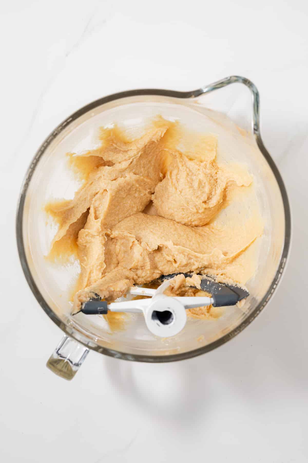 Wet ingredients mix in glass bowl.