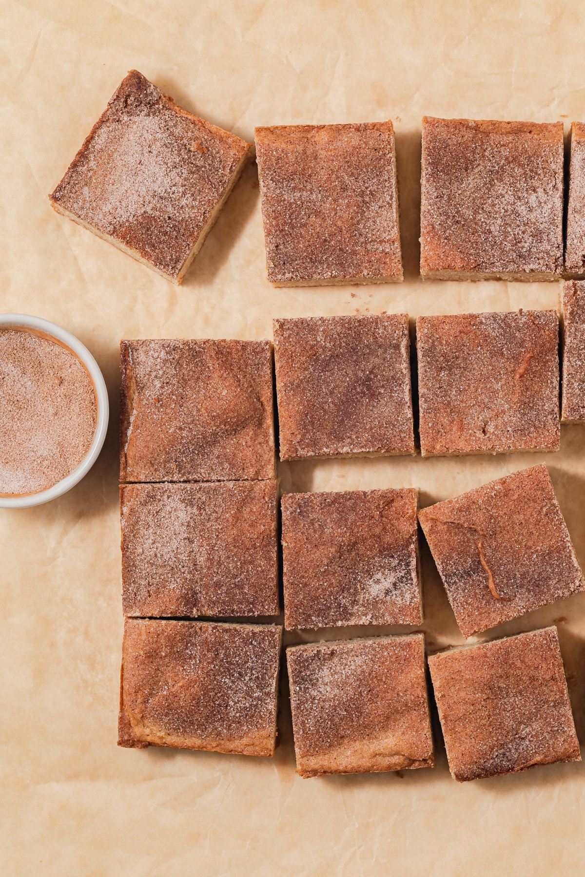 Overhead of snickerdoodle blondies on parchment paper.