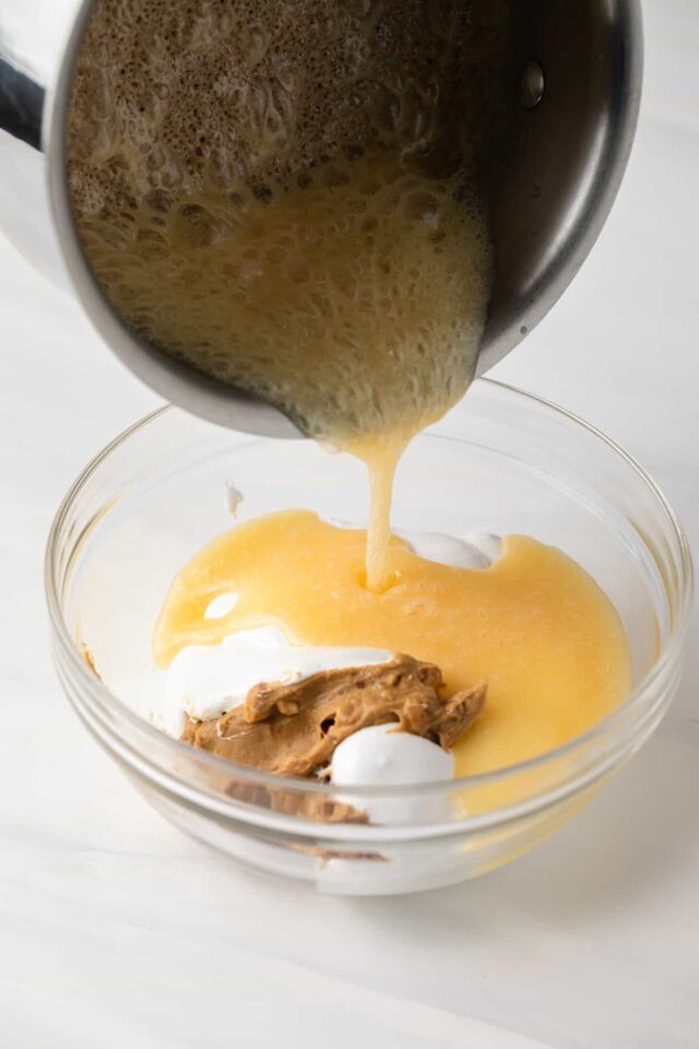 Butter being poured over sugar