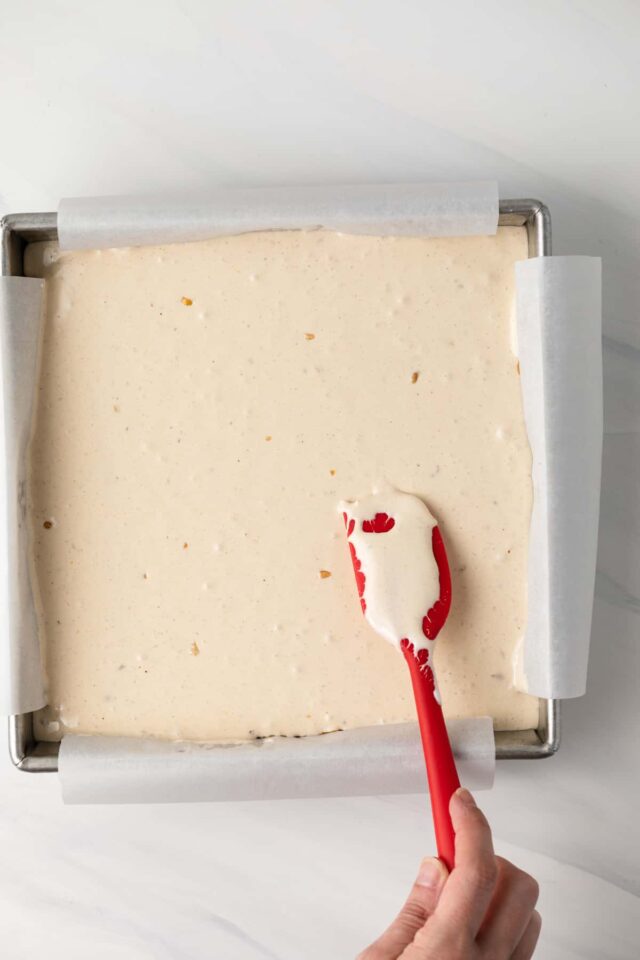 Nougat being spread on brownies
