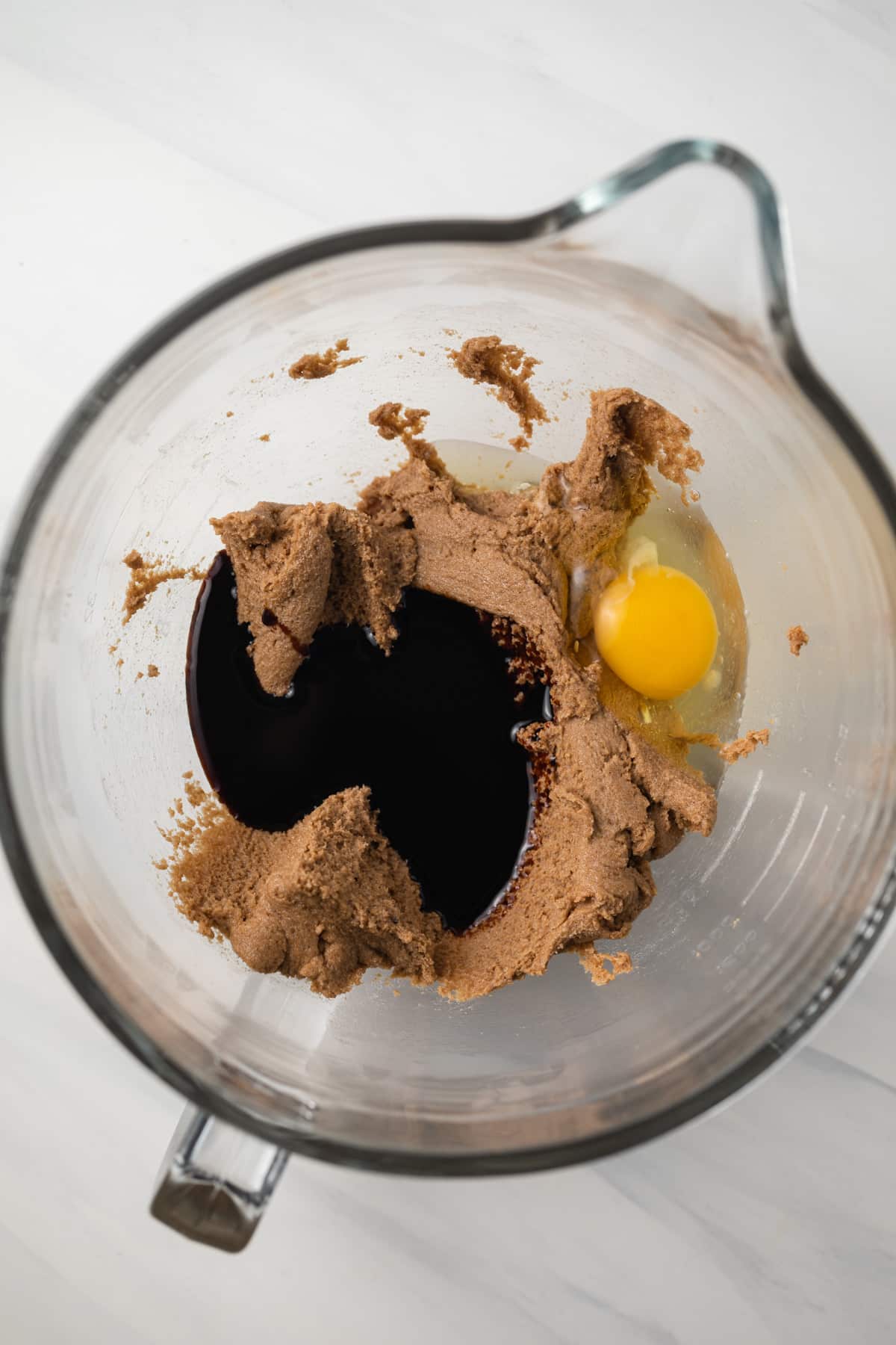 Egg and molasses in butter sugar mixture.
