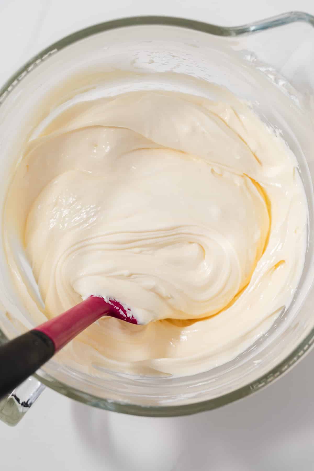 Cheesecake filling in glass bowl.