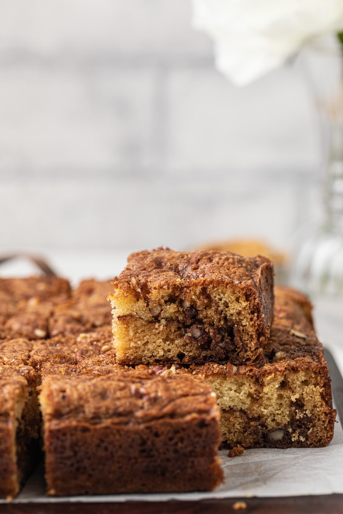 cinnamon swirl sour cream coffee cake stacked on wooden board