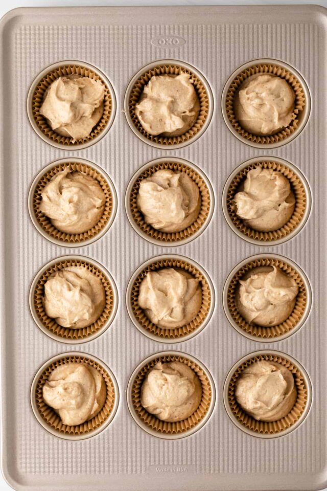 Apple spice cupcake batter in a muffin pan