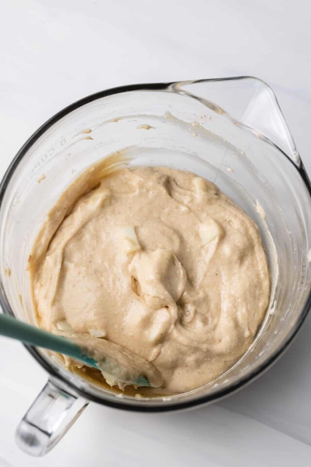 Spiced apple cake batter in a mixing bowl