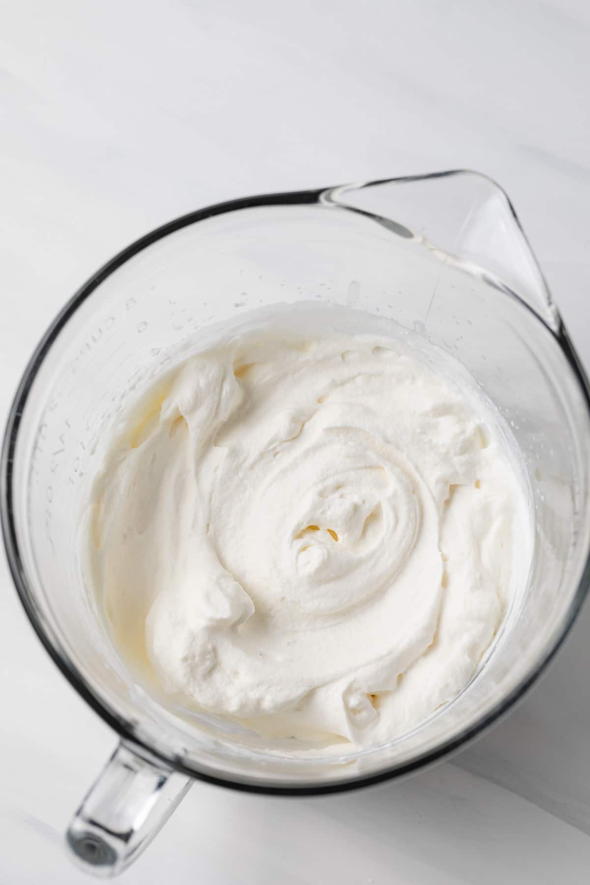stabilized whipped cream in glass bowl