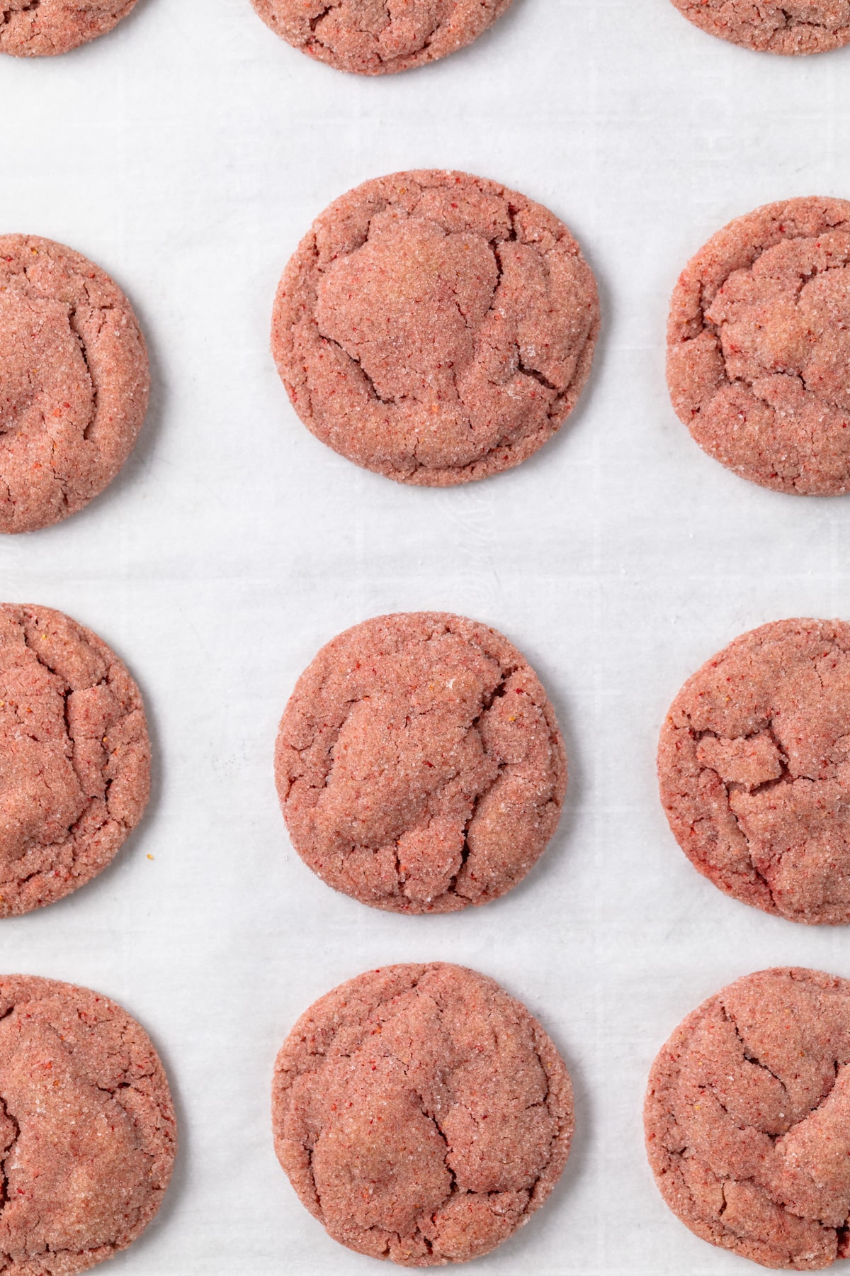 Strawberry cookies on a baking sheet.