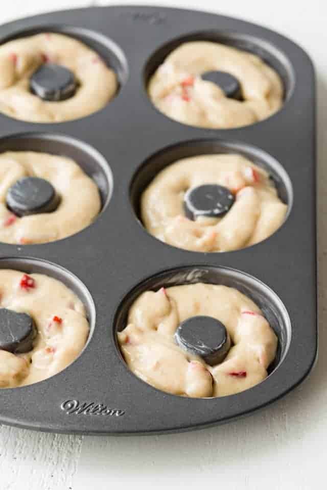 Strawberry donut batter in donut pan