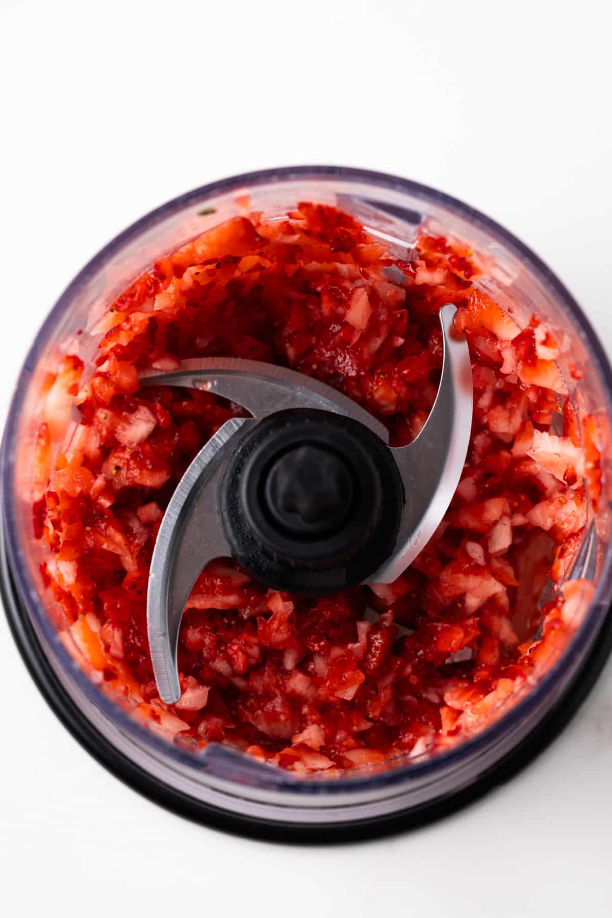 Minced strawberries in a blender.
