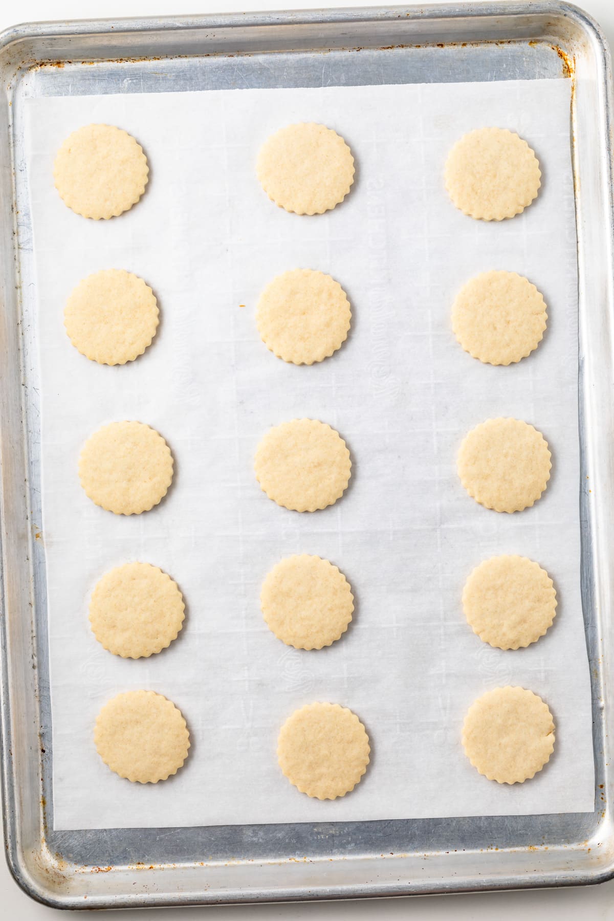 Cut out cookies on baking sheet.