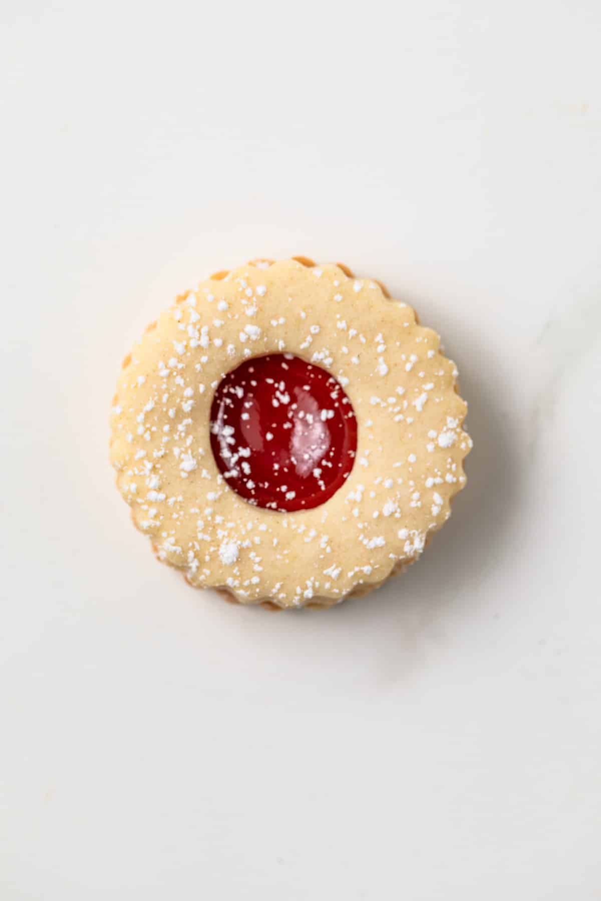 One strawberry linzer cookie.