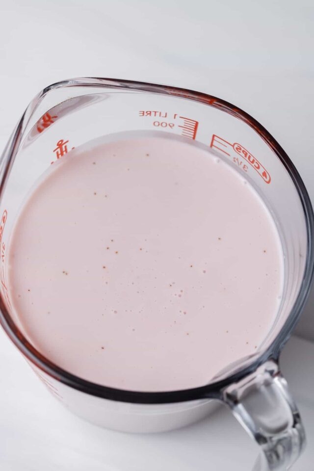 strawberry panna cotta in an ice bath