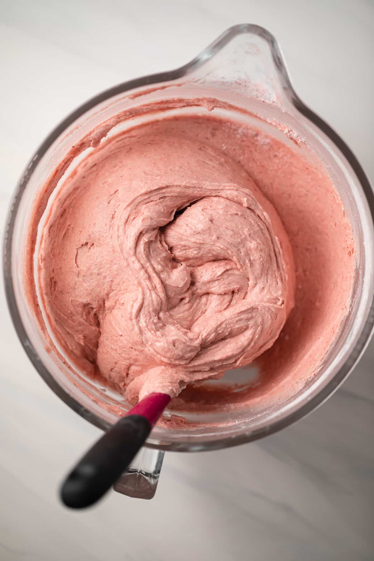 Strawberry pound cake batter in glass bowl.