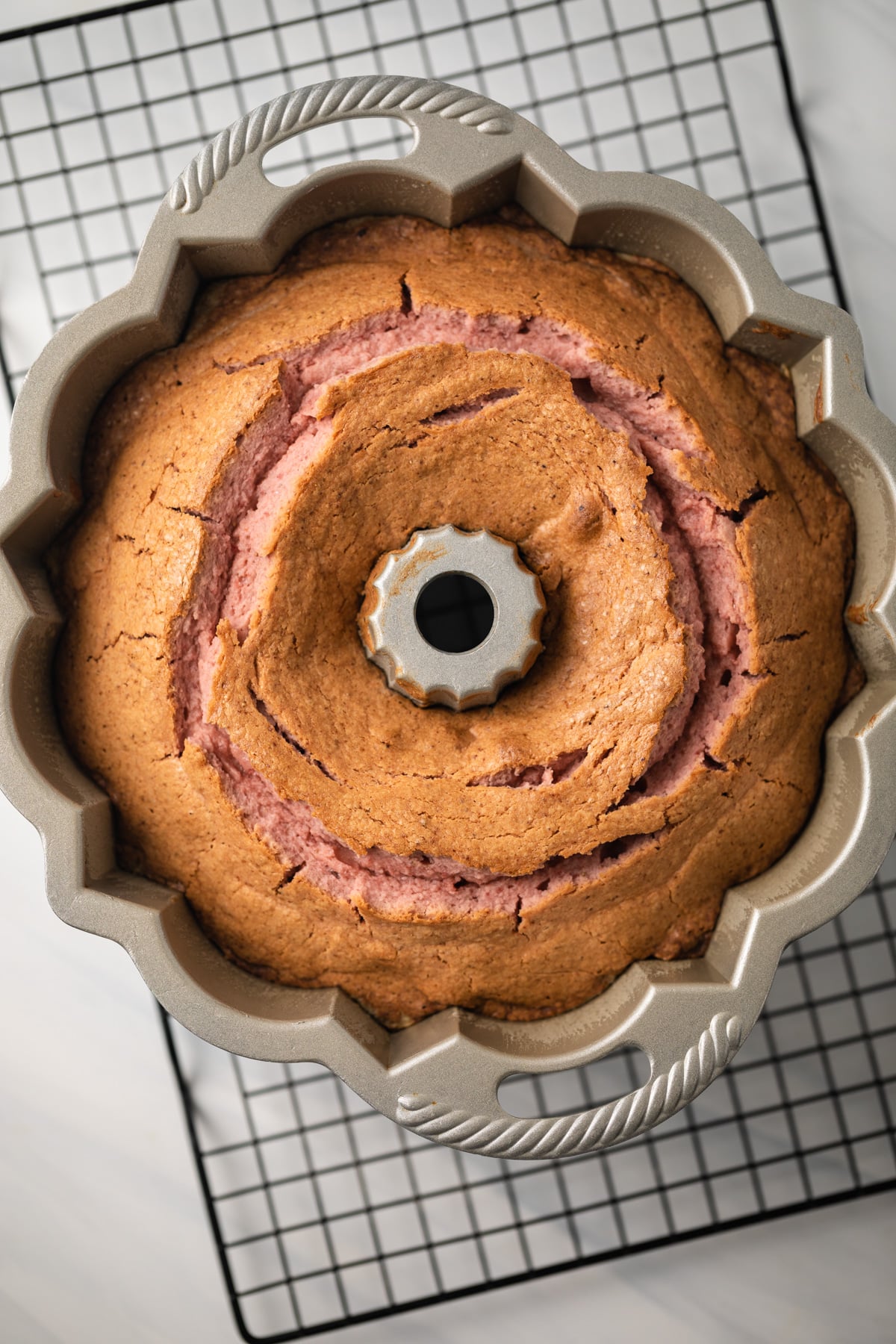 Baked strawberry pound cake in bundt pan.