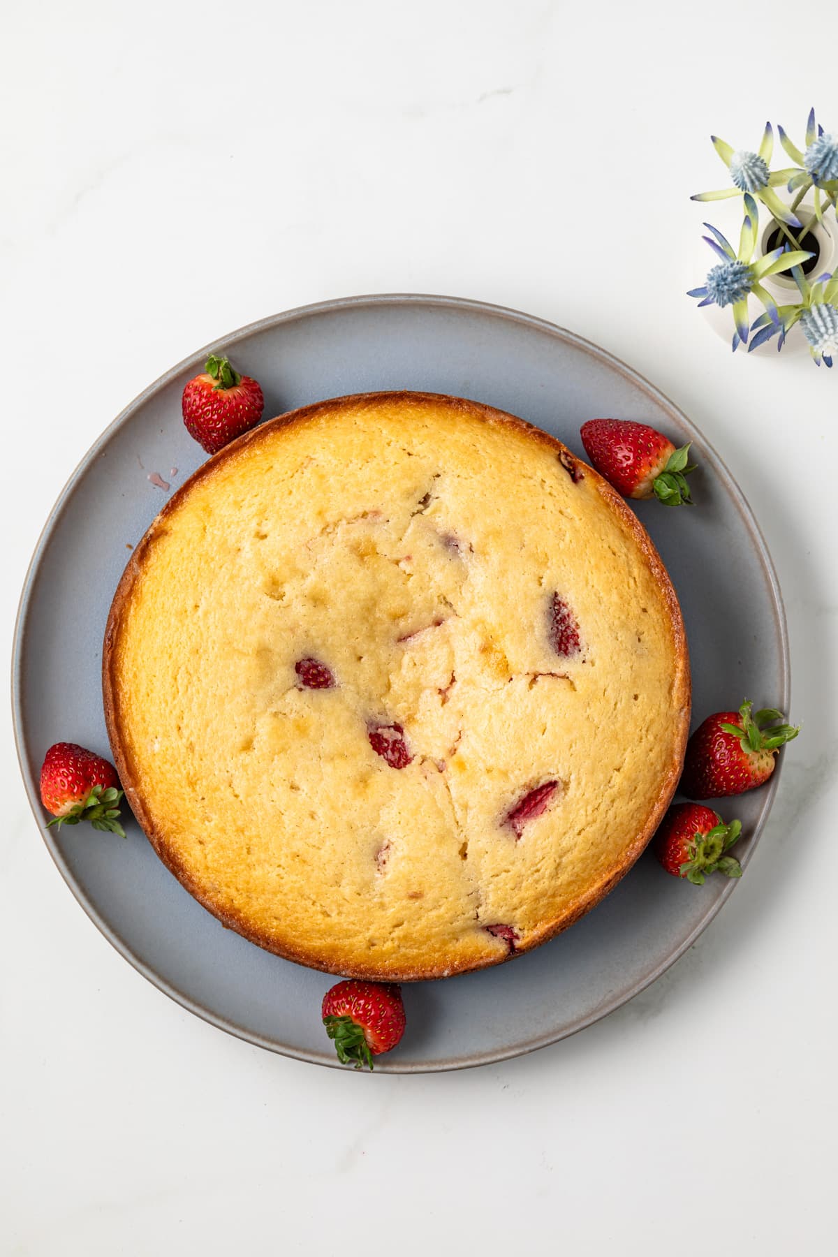 Strawberry ricotta cake on plate.