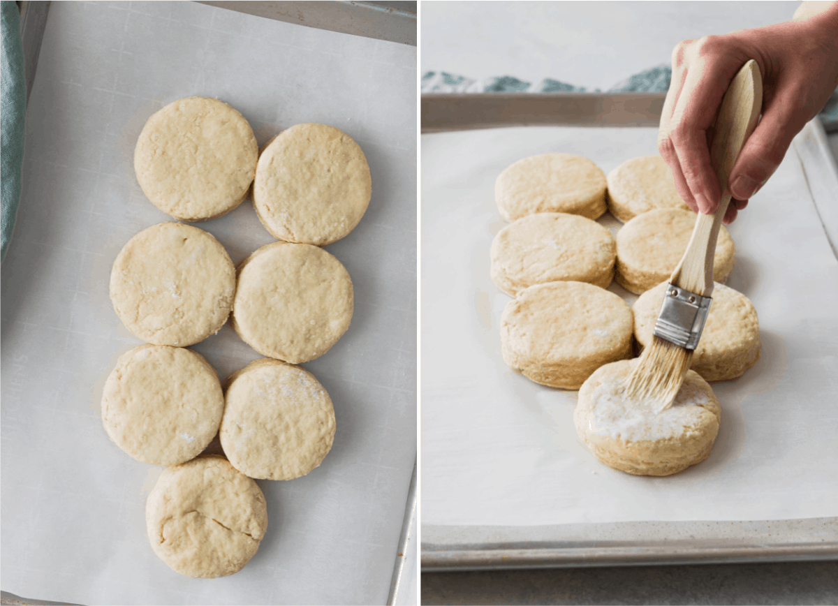 biscuits on a baking sheet being brushed with milk