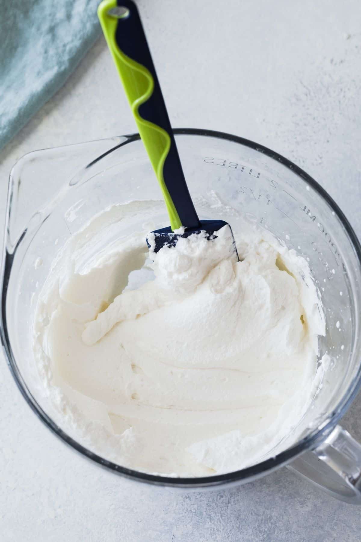whipped cream in a glass bowl