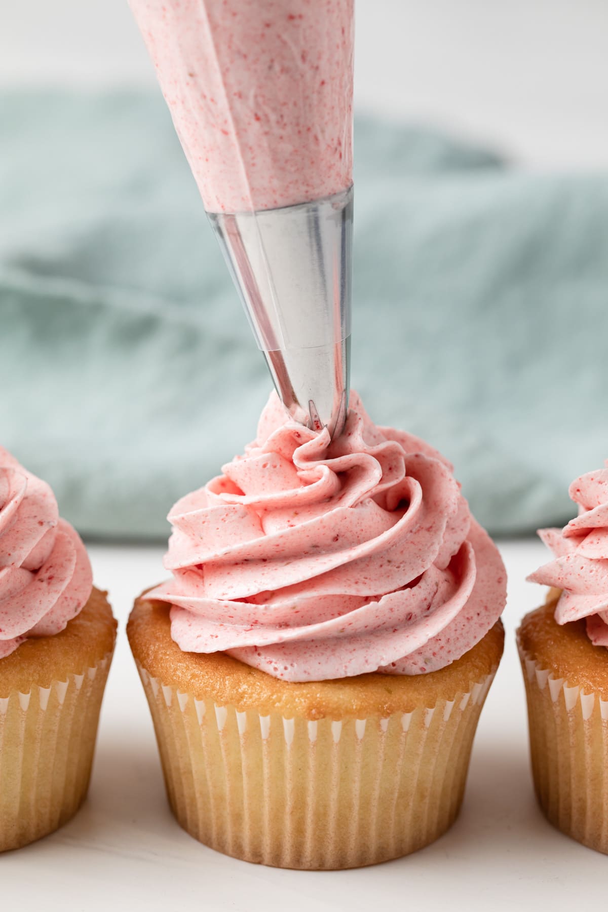 strawberry buttercream piped on a cupcake