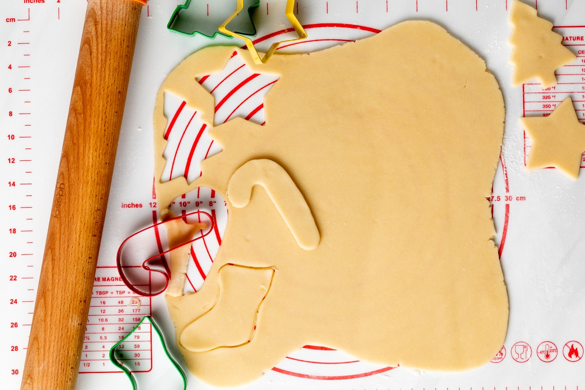 sugar cookie dough cut out with cookie cutters