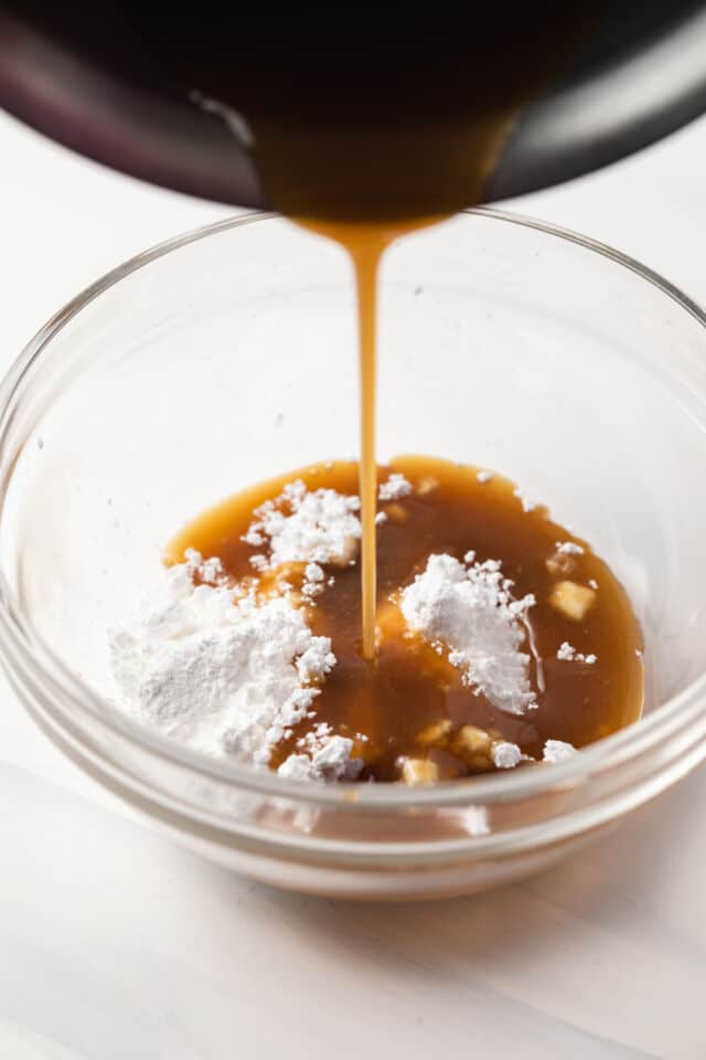 Melted brown sugar mixture poured over powdered sugar.