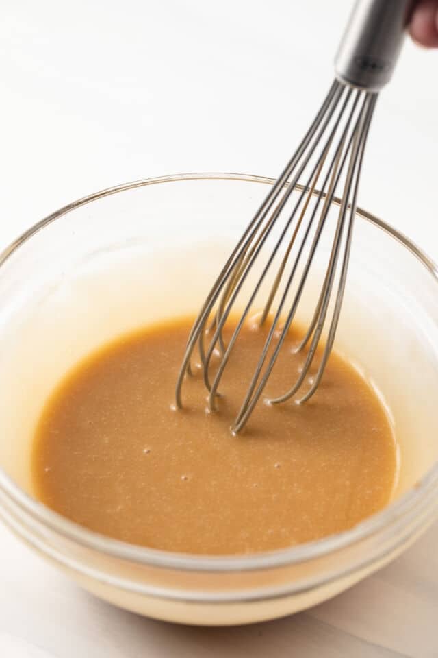 Brown sugar glaze in glass bowl.