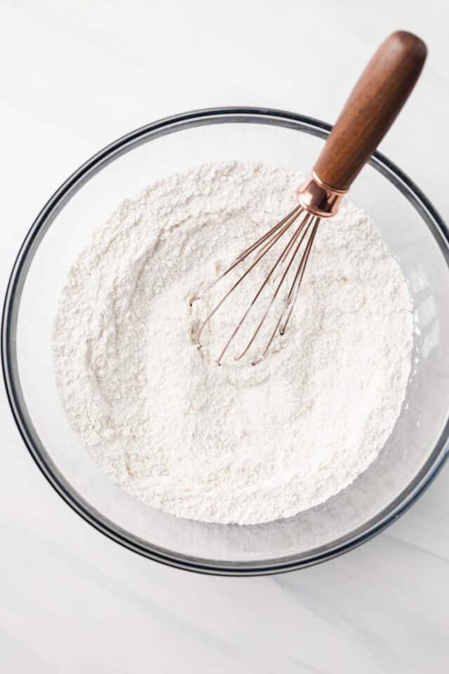 Dry ingredients combined in glass bowl.