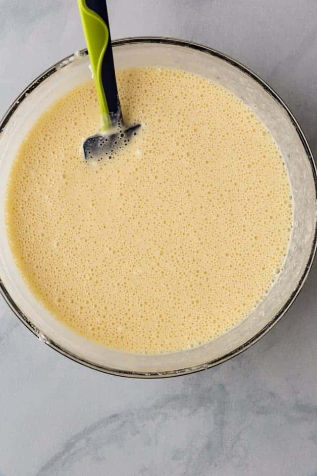 tres leches cake batter in a glass bowl