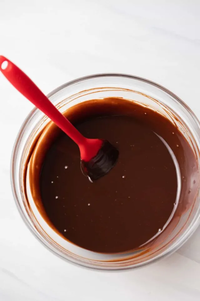 Melted chocolate in glass bowl.