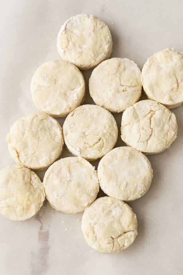 Unbaked honey cream cheese biscuits on a pan