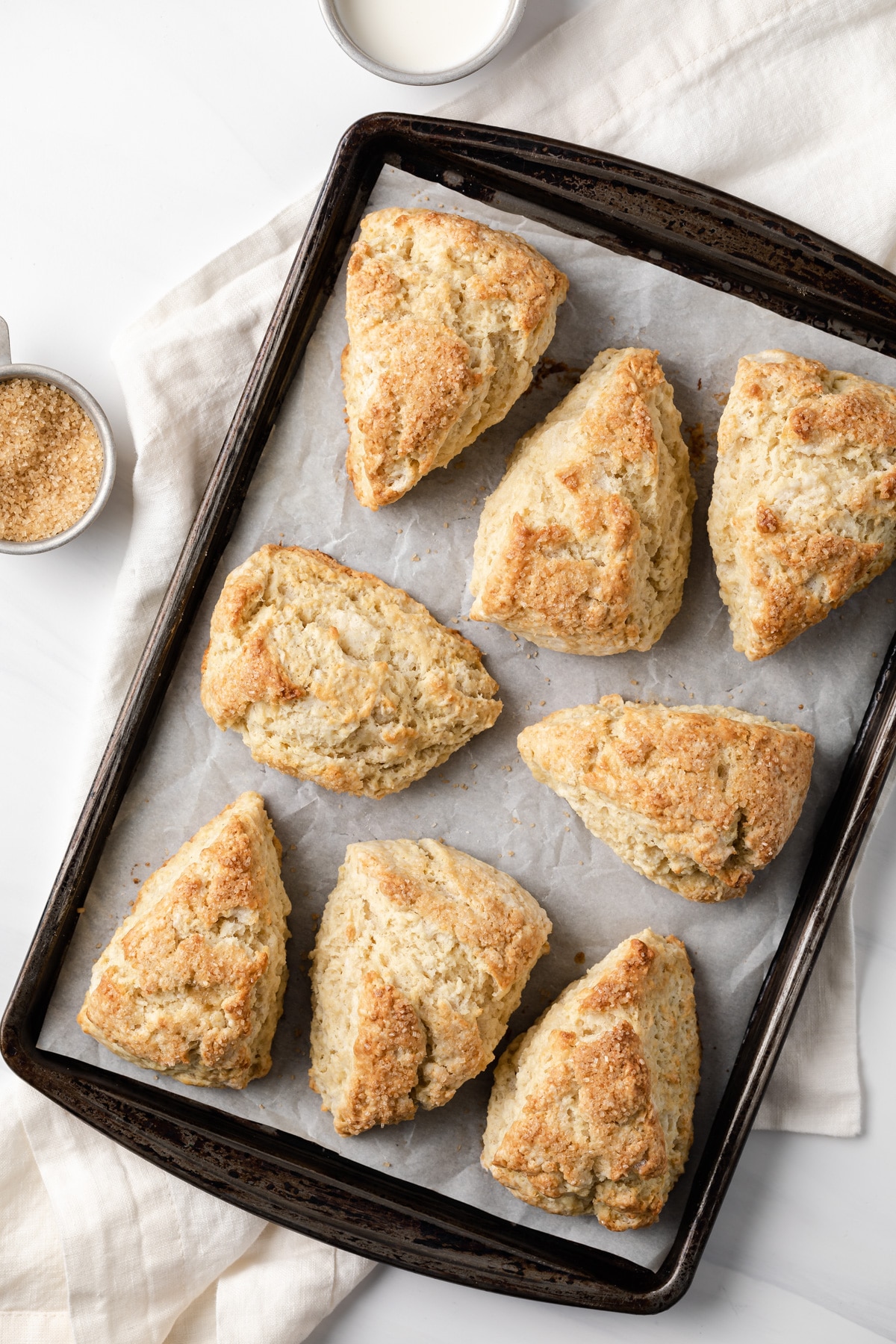 overhead view of vanilla cardamom scones on baking sheet