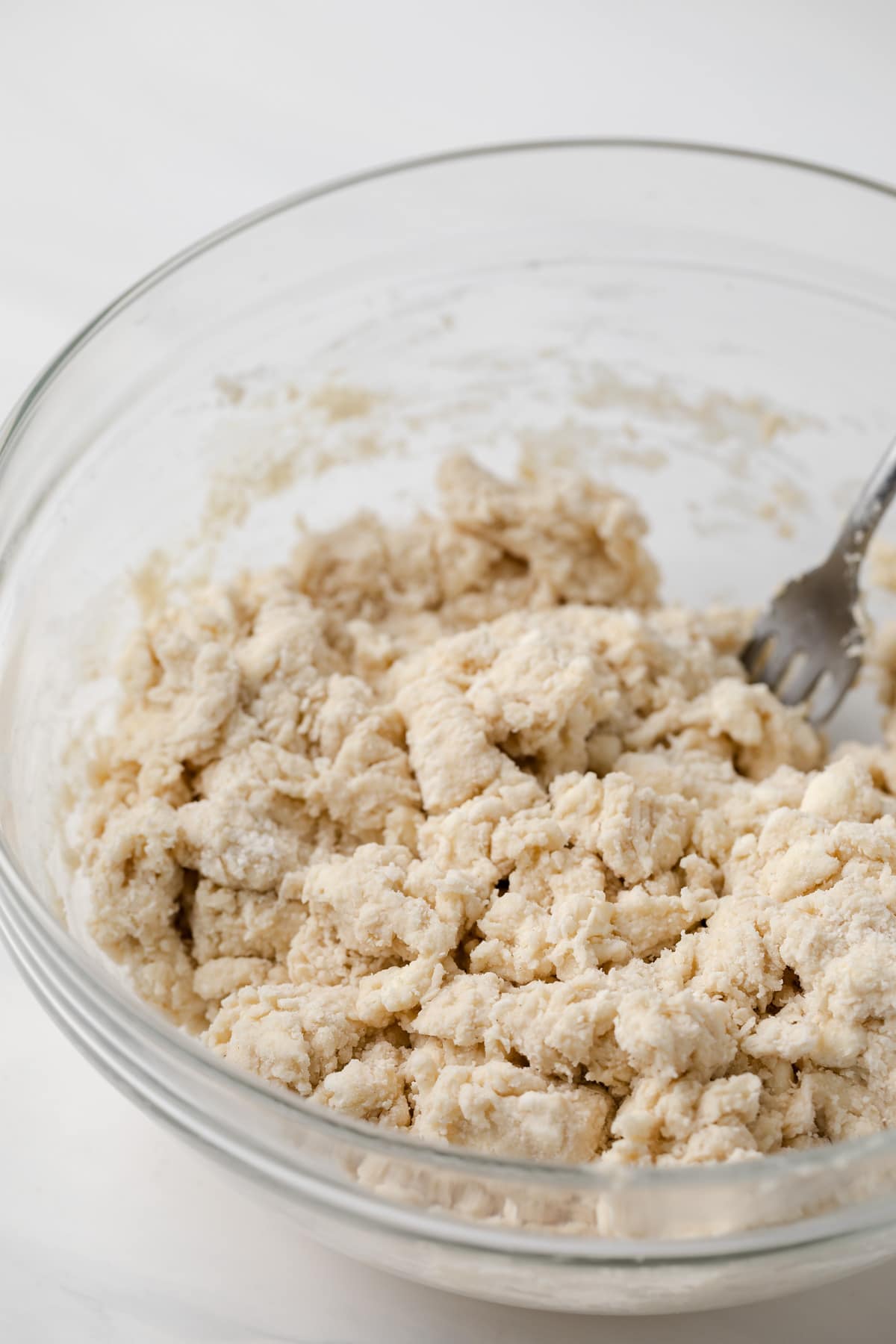 shaggy scone dough in glass bowl