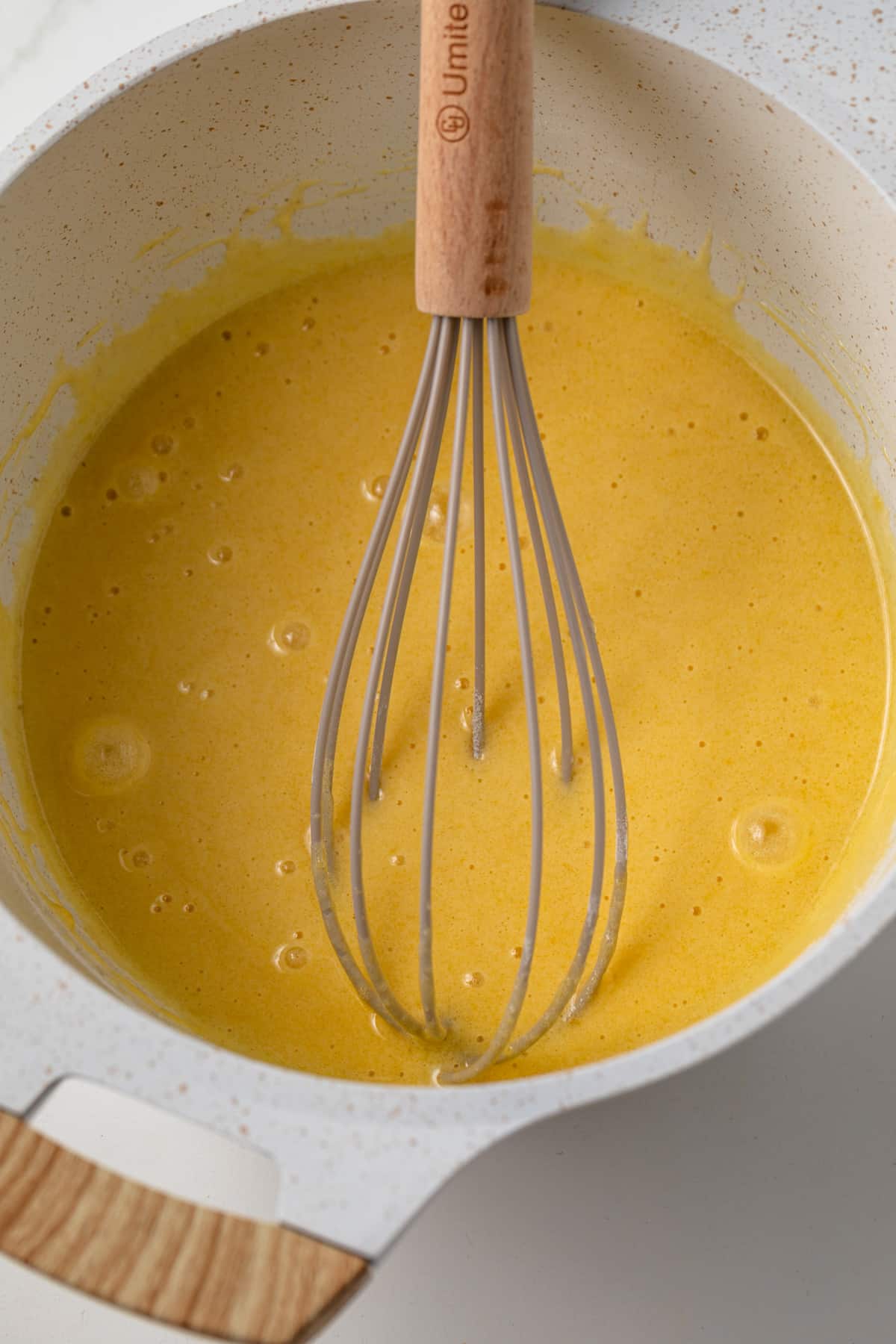 Eggs whisked with flour, sugar, and salt.