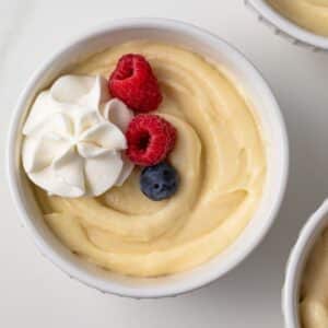 Overhead of vanilla pudding in white bowl.