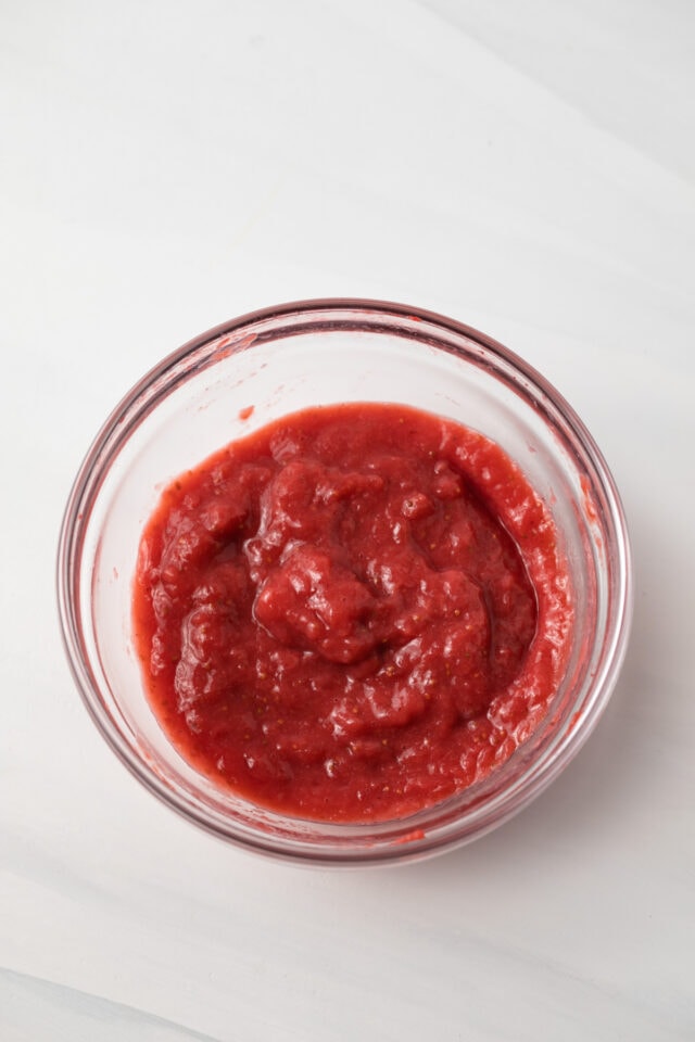 Pureed strawberries in glass bowl.