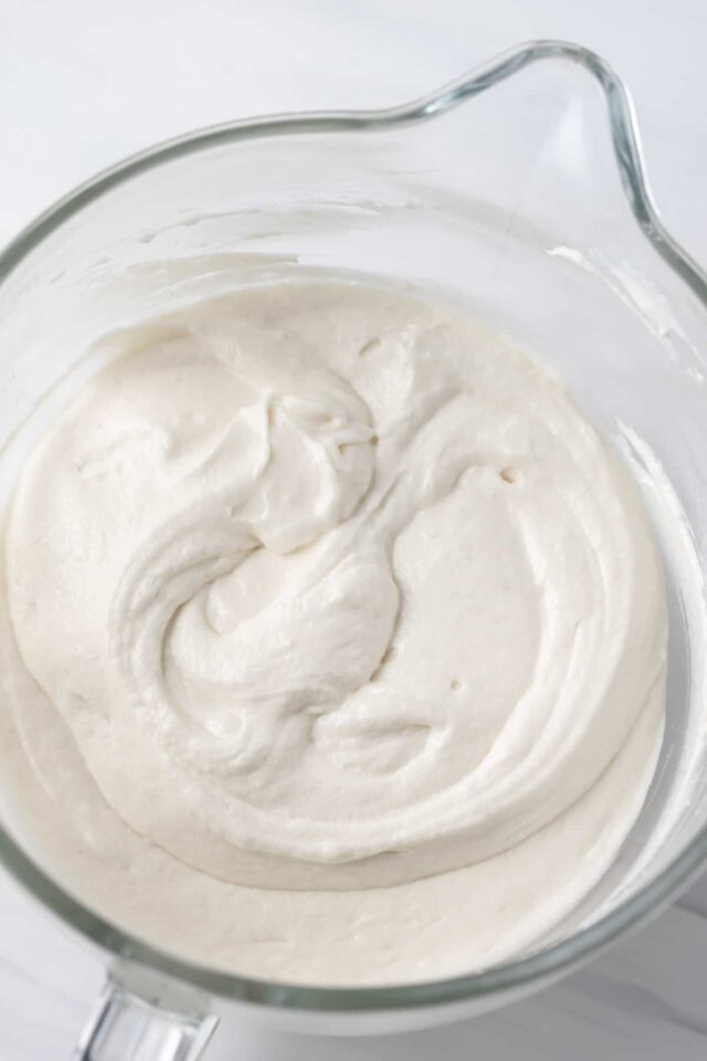 White cake batter in a mixing bowl
