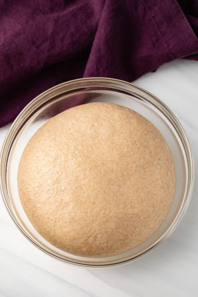Proofed dough in glass bowl