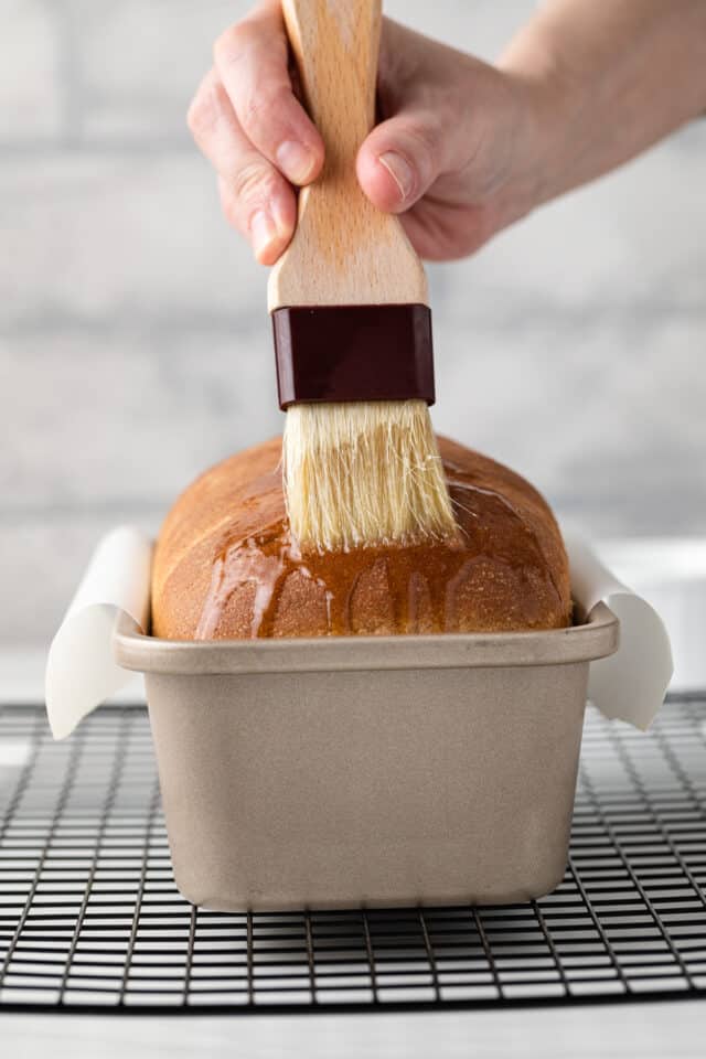 Butter brushed over baked whole wheat bread