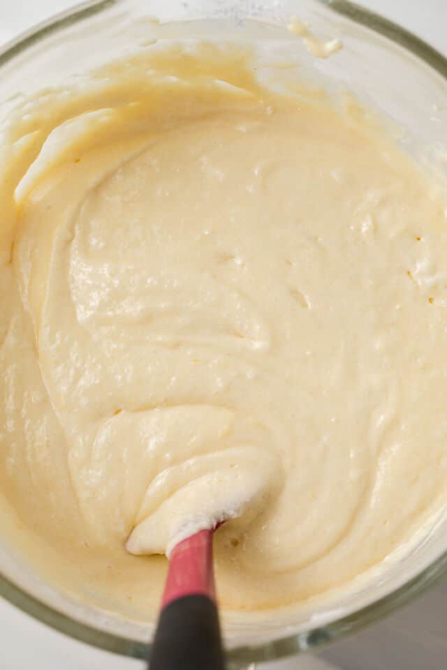 Yellow cake batter in glass bowl.