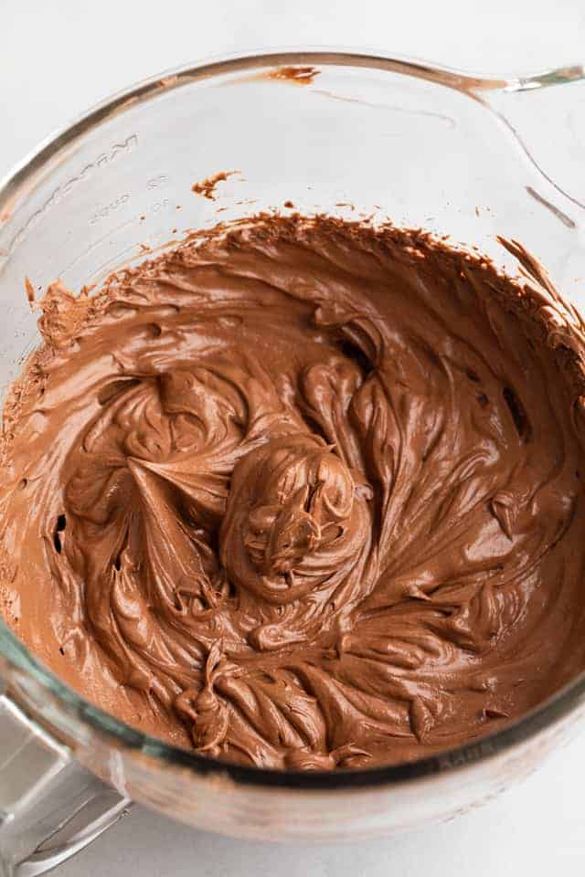 chocolate frosting in glass bowl